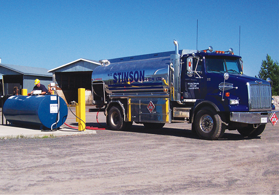 Image of a Stinson worker and his truck fueling up a propane tank